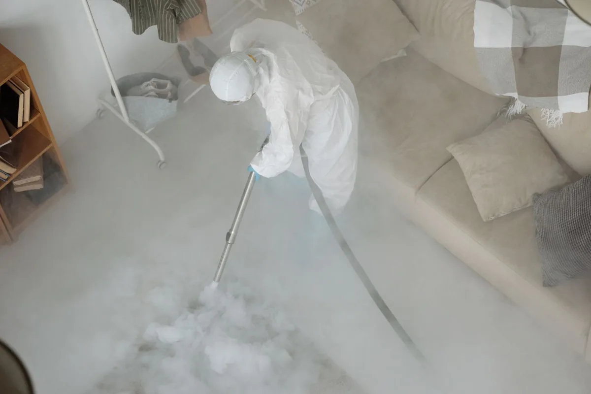 Biohazard cleanup technician in protective equipment, Vilonia, AR